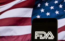 FDA on phone in front of American flag